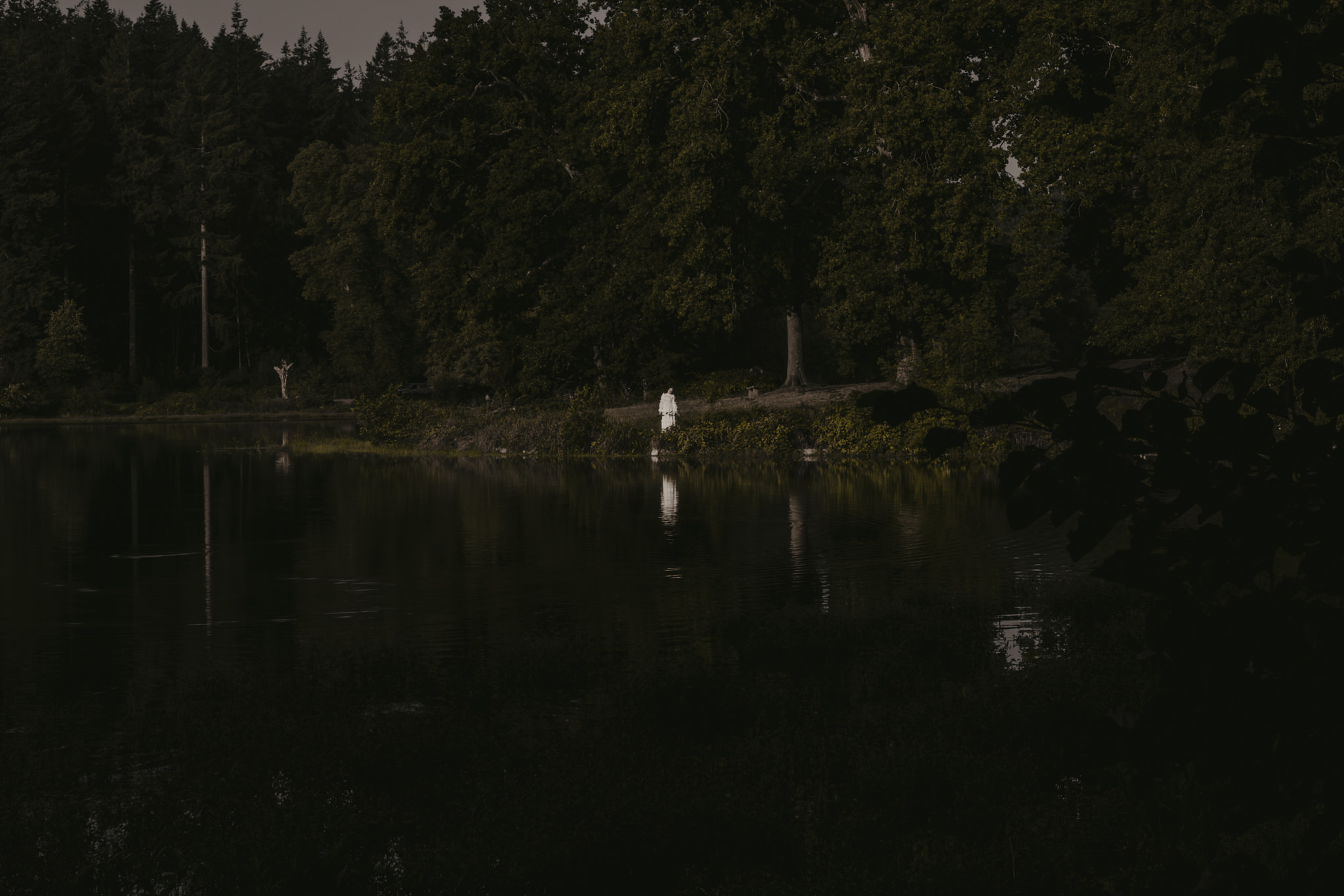 Landscape of shearwater lake, with creepy figure in the distance - Horror photography tips